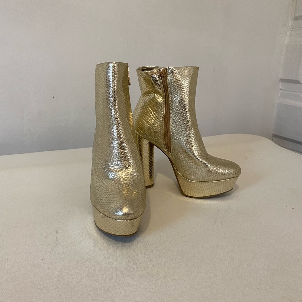 Gold platform heeled boots